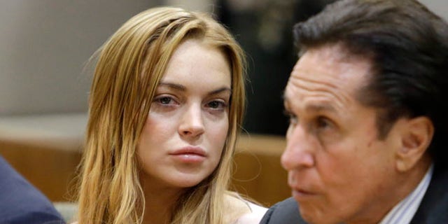 March 18, 2013: Actress Lindsay Lohan, left, and her attorney Mark Heller appear at a hearing in Los Angeles Superior Court.