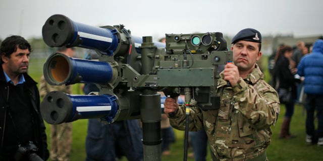 May 3, 2012: In this file photo, Sergeant Craig from Britain's Royal Artillery regiment holds a high-velocity missile, or HVM, lightweight multiple launcher during a media event ahead of a training exercise designed to test military procedures prior to the Olympic period in Blackheath, London.