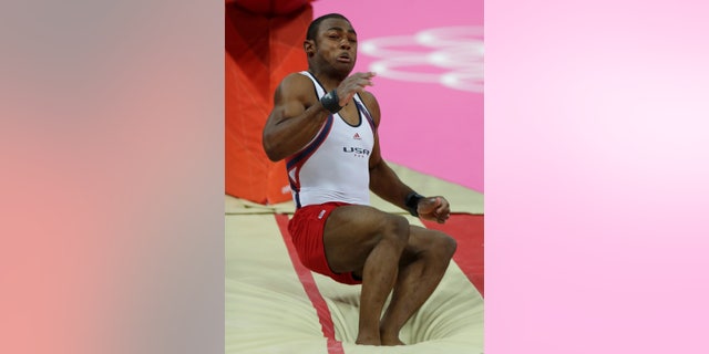 U.S. gymnast John Orozco botches his dismount on the vault during the Artistic Gymnastic men's team final at the 2012 Summer Olympics, Monday, July 30, 2012, in London. (AP Photo/Gregory Bull)