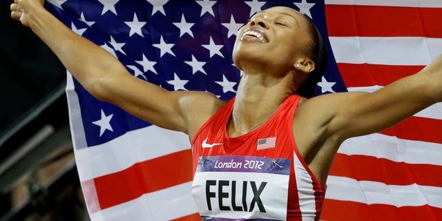 United States' Allyson Felix celebrates her in win the women's 200-meters during the athletics in the Olympic Stadium at the 2012 Summer Olympics, London, Wednesday, Aug. 8, 2012. (AP Photo/Lee Jin-man)