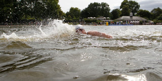Aug. 13, 2011: In this file photo, Germany's Thomas Lurz races during the 10-kilometer marathon swimming International Olympic test event at Hyde Park's Serpentine lake in London.