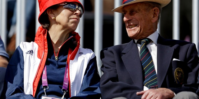 Princess Anne, left, mother of Great Britain equestrian rider Zara Phillips, attends the equestrian eventing dressage phase with Prince Phillip the Duke of Edinburgh, husband of Britain's Queen Elizabeth II, at the 2012 Summer Olympics, Sunday, July 29, 2012, in London. (AP Photo/David Goldman)
