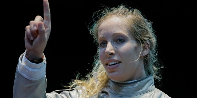 Aug. 1, 2012: The United States' Mariel Zagunis asks for a ruling in her match against Japan's Seira Nakayama in the women's individual sabre fencing competition at the 2012 Summer Olympics in London.