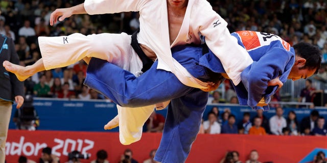 July 30, 2012: Nicholas Delpopolo of the United States, left, and Nyam Ochir Sainjargal of Mongolia compete during the men's 73-kg judo competition at the 2012 Summer Olympics in London.