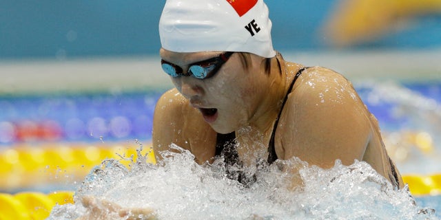 China's Ye Shiwen competes in a women's 200-meter individual medley swimming heat at the Aquatics Centre in the Olympic Park during the 2012 Summer Olympics in London, Monday, July 30, 2012. (AP Photo/Michael Sohn)