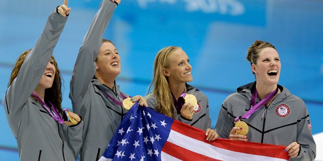 Aug. 1, 2012: From right, United States' Missy Franklin, United States' Dana Vollmer, United States' Allison Schmitt and United States' Shannon Vreeland pose with their gold medals for the women's 4x200-meter freestyle relay swimming final at the Aquatics Centre in the Olympic Park during the 2012 Summer Olympics in London.