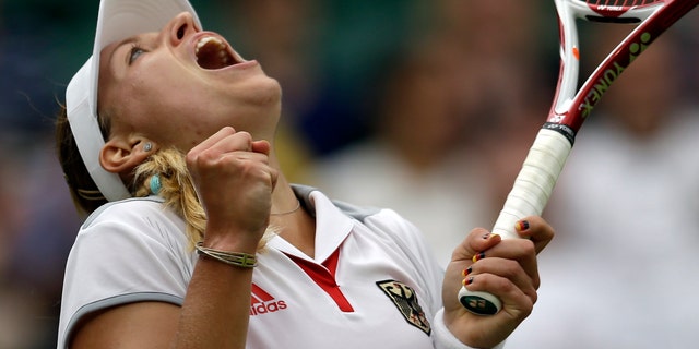 Angelique Kerber of Germany reacts during her match against Victoria Azarenka of Belarus at the All England Lawn Tennis Club in Wimbledon, London at the 2012 Summer Olympics, Thursday, Aug. 2, 2012. (AP Photo/Elise Amendola)