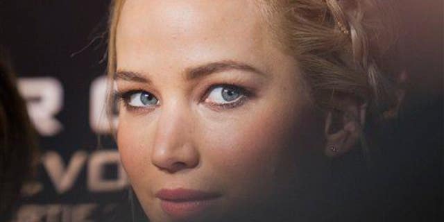 "Attractive" actress Jennifer Lawrence poses for photographers.