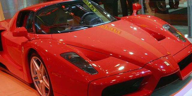 SYDNEY - OCTOBER 17: The new Ferrari Enzo is revealed at the Sydney International Motor Show on October 17, 2002 in Sydney, Australia. The Enzo is modelled on Ferrari's F1 race cars and is the fastest production car in the world. More than 60 cars will be on debut at the Sydney International Motorshow showcasing the latest designs and future concepts from the world's leading Automotive companies. (Photo by Cameron J Spencer/Getty Images)