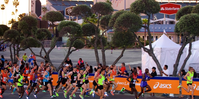 March 15, 2015: Men's elite runners start the 30th Los Angeles Marathon. The 26.2-mile event begins at Dodger Stadium and ends in Santa Monica, Calif. (AP Photo/Damian Dovarganes)