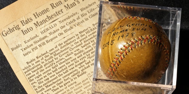 July 5, 2012: A baseball that New York Yankees slugger Lou Gehrig hit for a World Series home run in 1928 is on display at a convention center in Kansas City, Mo.