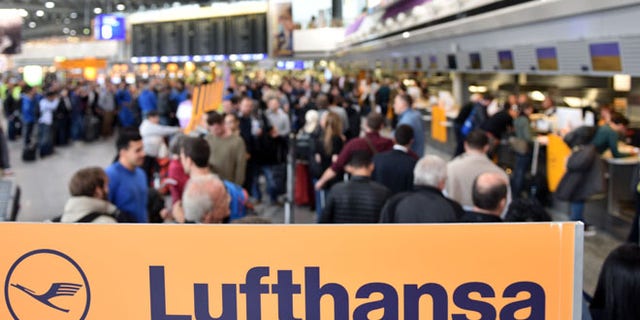 FRANKFURT AM MAIN, GERMANY - NOVEMBER 06: Passengers of the German airline Lufthansa wait at terminal 1 at Frankfurt Airport during an strike over salaries at Frankfurt and Dusseldorf airports on November 6, 2015 in Frankfurt, Germany. The UFO labor union, which represents the crews, has resorted to the strike following failed negotiations with Lufthansa and is leaving the option open for further strikes in coming days. (Photo by Thomas Lohnes/Getty Images)