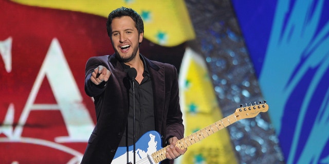 Luke Bryan accepts the award for 'Artist of the Year' during the American Country Awards on Dec. 10, 2012.