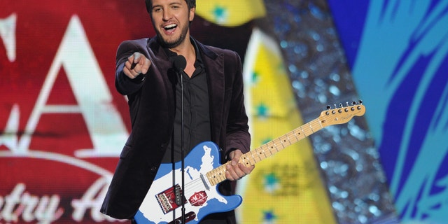 Luke Bryan accepts the award for 'Artist of the Year' during the American Country Awards on Dec. 10, 2012.