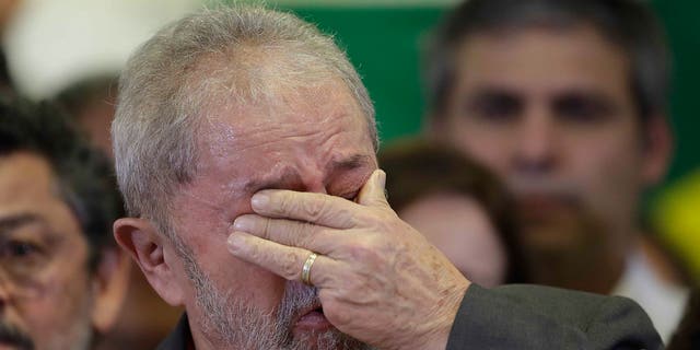 Lula da Silva weeps during a news conference on the corruption charges he is facing, on Thursday, Sept. 15, 2016.