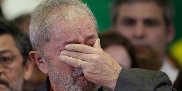 Lula da Silva weeps during a news conference on the corruption charges he faced that ultimately landed him in jail.