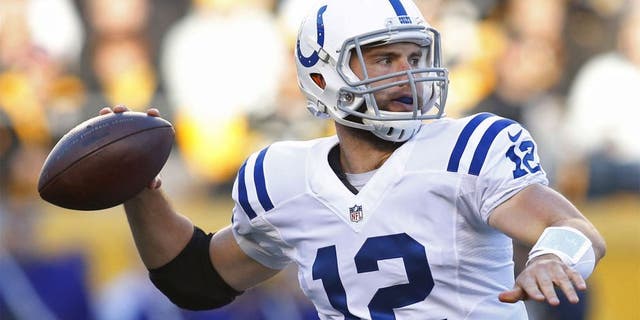 Oct 26, 2014; Pittsburgh, PA, USA; Indianapolis Colts quarterback Andrew Luck (12) passes against the Pittsburgh Steelers during the first quarter at Heinz Field. Mandatory Credit: Charles LeClaire-USA TODAY Sports