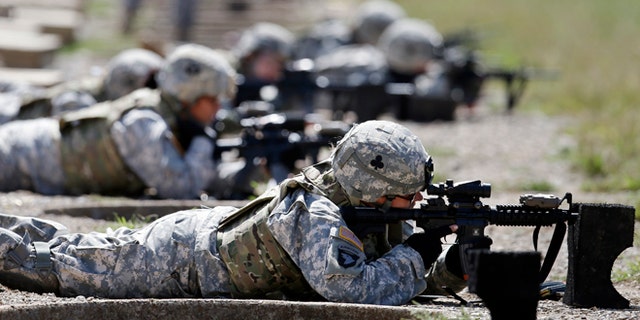 Sept. 18, 2012: Female soldiers from 1st Brigade Combat Team, 101st Airborne Division train on a firing range while testing new body armor in Fort Campbell, Ky., in preparation for their deployment to Afghanistan.