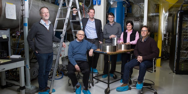Rainer Weiss (center, seated) poses with members of the MIT LIGO team. Weiss was honored along with Caltech's Barry Barish and Kip Thorne with the 2017 Nobel Prize in physics for detecting gravitational waves.