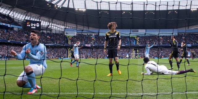 FILE - In this Feb. 24, 2013 file photo, Manchester City's Sergio Aguero, left, celebrates after a goal by teammate Yaya Toure, not shown, during their English Premier League soccer match against Chelsea at The Etihad Stadium in Manchester, England. The New York Yankees are partnering with Manchester City to own Major League Soccer's 20th team, which will be called New York City Football Club and plans to start play in the 2015 season. (AP Photo/Jon Super, File)