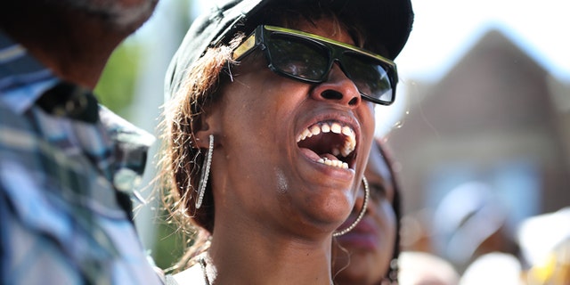 Diamond Reynolds, the girlfriend of Philando Castile, weeps during a press conference at the Governor'sResidence in St. Paul, Minn., Thursday, July 7, 2016. Philando Castile was shot in a car Wednesday night by police in the St. Paul suburb of Falcon Heights. Police have said the incident began when an officer initiated a traffic stop in suburban Falcon Heights but have not further explained what led to the shooting. (Leila Navidi/Star Tribune via AP)