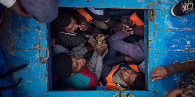 A group of refugees found in unsafe conditions aboard a wooden ship.