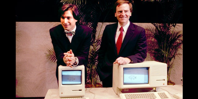 This January 1984 photo shows Apple CEO Steven P. Jobs, left and President John Sculley presenting the new Macintosh Desktop Computer in January 1984 at a shareholder meeting in Cupertino, Calif. January 24, 2014, marks thirty years after the first Mac computer was introduced.