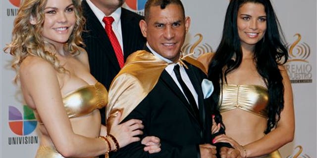 Feb. 16, 2012 : Former boxing champion Hector "Macho" Camacho, front center, poses for photographers at his arrival to the Premio Lo Nuestro Music Awards in Miami.