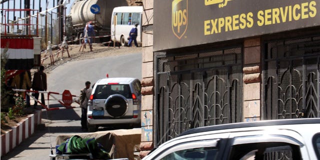 Nov. 2: Policemen guard UPS office in San'a, Yemen.