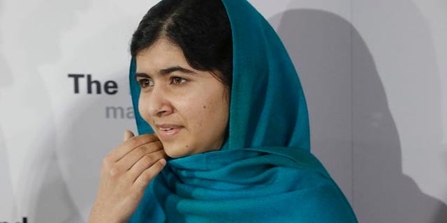 Oct. 10, 2013: Malala Yousafzai poses for photographs in New York. Yousafzai, was shot by the Taliban for her advocating education for girls.