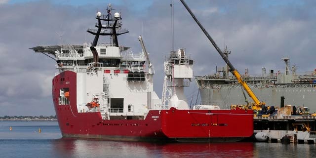FILE - In this March 30, 2014 file photo, Australian navy ship Ocean Shield lies docked at naval base HMAS Stirling while being fitted with a towed pinger locator to aid in her roll in the search for missing Malaysia Airlines Flight MH370 in Perth, Australia. (AP Photo/Rob Griffith, File)