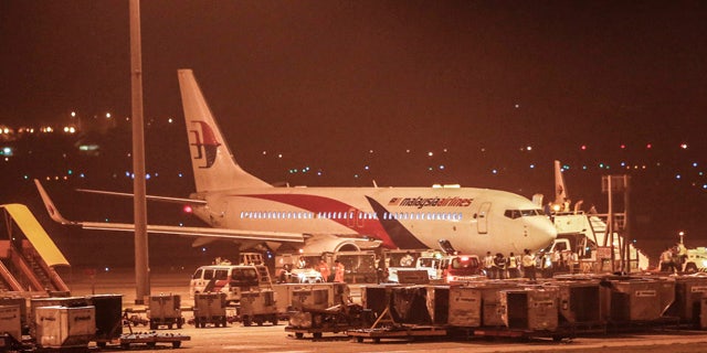 April 21, 2014: Malaysia Airlines flight MH192 bound for Bangalore turned back toward and parked at Kuala Lumpur International Airport in Sepang, Malaysia after its right landing gear malfunctioned upon takeoff. The airline says Flight 192 carrying 166 people landed safely at the Kuala Lumpur International Airport early Monday, four hours after it departed. (AP Photo/Vincent Thian)