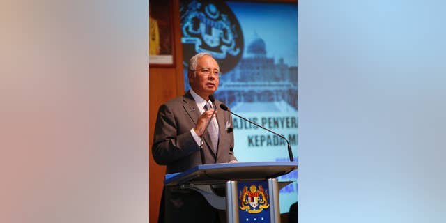 FILE - In this Wednesday, July 8, 2015 file picture t Malaysian Prime Minister Najib Razak speaks during Perdana Fellowship Programme in Putrajaya, Malaysia. Embattled Malaysian Prime Minister Najib Razak is not known to be a risk-taker, but he made his biggest political gamble to stay in power last week as he got rid of critics in his Cabinet, sacked the attorney-general probing him and stalled investigations over leaked confidential documents that allegedly show some $700 million was siphoned out from a troubled state fund into his personal accounts. (AP Photo/Vincent Thian/FILE)