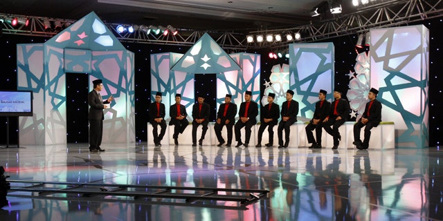 June 14: Contestants sit and listen to host Dzulkarnain Hamzah while filming the reality TV show "Imam Muda" or "Young Leader" at a mosque auditorium in Kuala Lumpur, Malaysia. (AP)