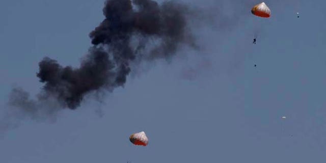 March 15, 2015: Pilots from Indonesias Jupiter aerobatics team are ejected after a mid-air collision during a practice session at the Langkawi International Maritime and Aerospace (LIMA) exhibition in Langkawi, Malaysia. (AP)