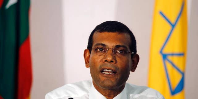 FILE- In this Nov. 10, 2013 file photo, former Maldives President and the then presidential candidate, Mohamed Nasheed, speaks to the media in Male, Maldives. Nasheed was convicted and sentenced to 13 years in prison on Friday, March 13, 2015, after a quick and disputed trial for allegedly ordering a senior judge arrested while in office. (AP Photo/Sinan Hussain, File)