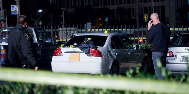 Dec. 15, 2012: Orange County Sheriff deputies patrol at Fashion Island mall in Newport Beach after witnesses reported multiple shots being fired in one of the parking lots.