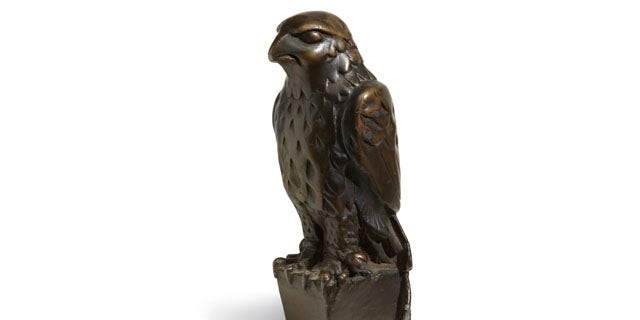 November 25, 2013: In this undated photo provided by Bonham’s Auction House, the “Maltese Falcon” is shown. The 45-pound, 12-inch-tall, black figurine cast in lead that was specifically made for John Huston's screen version of the film bears its name, sold for more than $4 million at auction by Bonham’s in New York. (AP Photo)