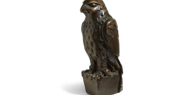 November 25, 2013: In this undated photo provided by Bonham’s Auction House, the “Maltese Falcon” is shown. The 45-pound, 12-inch-tall, black figurine cast in lead that was specifically made for John Huston's screen version of the film bears its name, sold for more than $4 million at auction by Bonham’s in New York. (AP Photo)