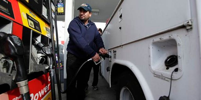 April 15: A motorist fills up his tank at a Shell gas station in Seattle.
