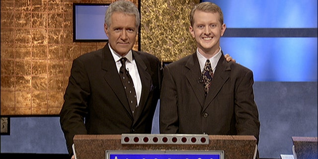 Software developer Ken Jennings from Salt Lake City, Utah poses for a photo with Jeopardy host Alex Trebek on the set of the show in Culver City, Calif. On Thursday Jan. 13, 2011 IBM computer Watson will play a practice round against Jennings, who won a record 74 consecutive "Jeopardy!" games in 2004-05.
