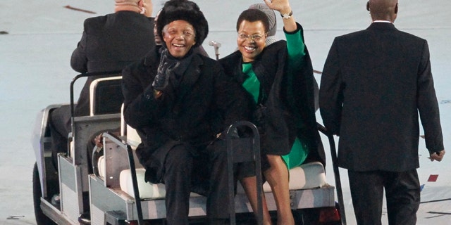 July 11: Former South African President Nelson Mandela waves to the crowd at the World Cup closing ceremonies. (AP)
