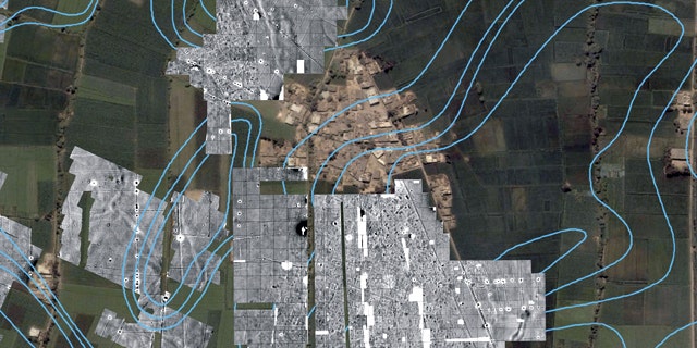 A color satellite image with radar imaging in monochrome showing the outlines of streets, houses and temples underneath the green farm fields and modern town of Tel al-Dabaa, in Egypt. An Austrian archaeological team has used radar imaging to determine the size of the 3,500-year-old capital of Egypt's foreign occupiers, the Hyksos warrior people from Asia, the antiquities department said Sunday.