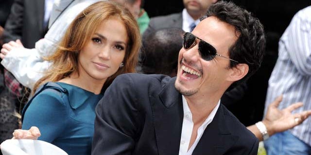MAY 23, 2011: Jennifer Lopez and her husband singer Mark Anthony pose at Simon Fuller's Hollywood Walk of Fame star presentation ceremony at Hollywood & Vine in Los Angeles, Calif.