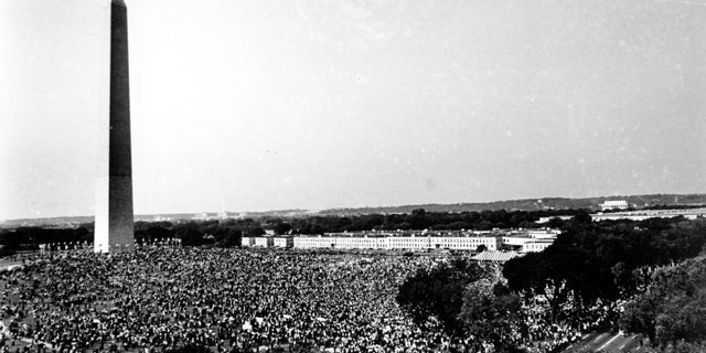 This Aug. 28, 1963, file photo shows civil rights demonstrators gather at the Washington Monument grounds before noon, before marching to the Lincoln Memorial, seen in the far background at right, where the March on Washington for Jobs and Freedom will end with a speech by Rev. Martin Luther King Jr., now known as the "I Have A Dream" speech. (AP Photo, File)