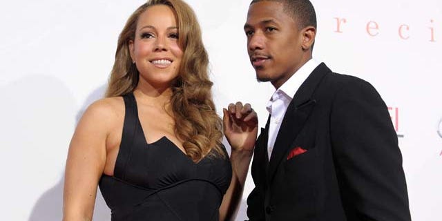 HOLLYWOOD - NOVEMBER 01: Actress/singer Mariah Carey (L) and actor Nick Cannon arrive at the screening of "Precious: Based On The Novel 'PUSH' By Sapphire" during AFI FEST 2009 held at Grauman's Chinese Theatre on November 1, 2009 in Hollywood, California. (Photo by Kevin Winter/Getty Images for AFI)