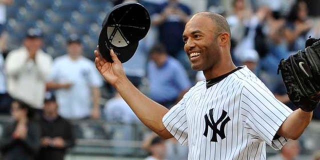 New York Yankees closer Mariano Rivera acknowledges the cheers of the crowd after recording his 602nd career save, after the Yankees beat the Minnesota Twins 6-4 in a baseball game, Monday, Sept. 19, 2011, at Yankee Stadium in New York. Rivera pitched a perfect ninth as he broke the record held by Trevor Hoffman. (AP Photo/Kathy Kmonicek)