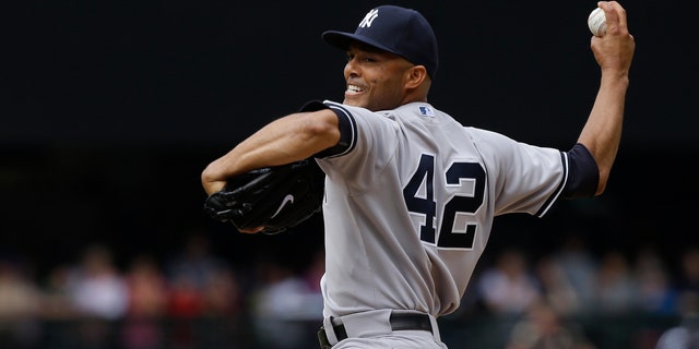 New York Yankees closing pitcher Mariano Rivera throws in the ninth inning of a baseball game against the Seattle Mariners, Sunday, June 9, 2013, in Seattle. Rivera earned the save as the Yankees defeated the Mariners 2-1. (AP Photo/Ted S. Warren)