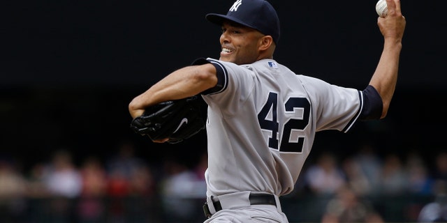 New York Yankees closing pitcher Mariano Rivera throws in the ninth inning of a baseball game against the Seattle Mariners, Sunday, June 9, 2013, in Seattle. Rivera earned the save as the Yankees defeated the Mariners 2-1. (AP Photo/Ted S. Warren)