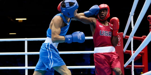 July 31, 2012: Jamel Herring, of the United States, right, fights Kazakhstan's Daniyar Yelessinov during their men's light welter 64-kg boxing match at the 2012 Summer Olympics, in London.
